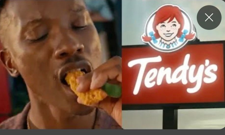 an image from a third dimension where rather than the Wendy's being blue, The name is Tendy's. 