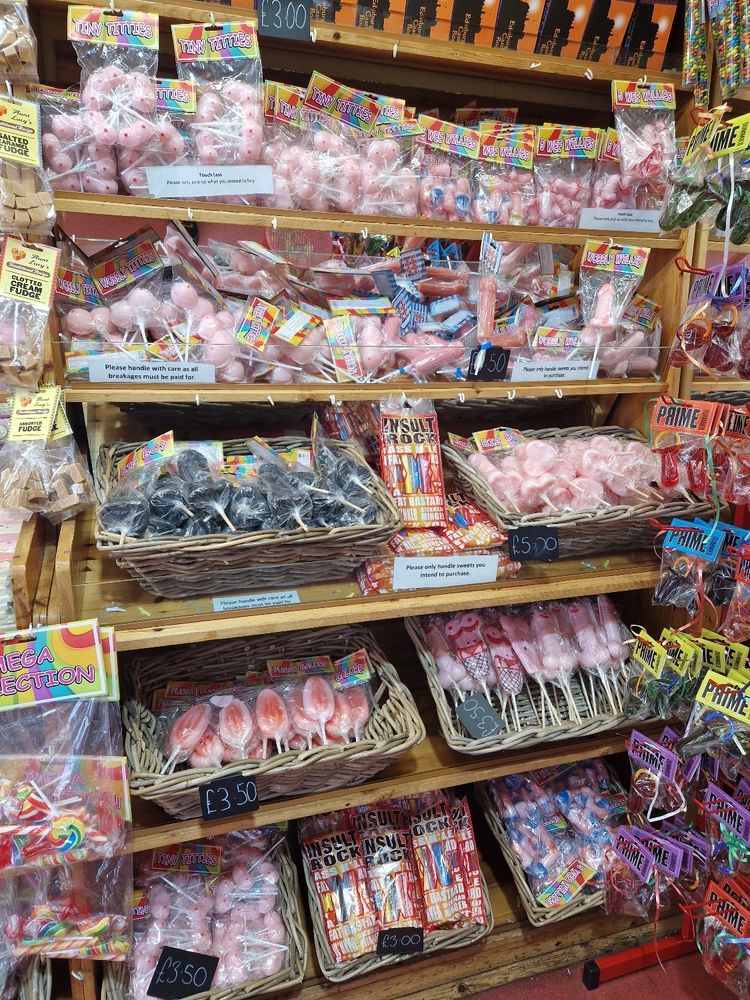 Sweet shop shelves with explicit shaped sweets