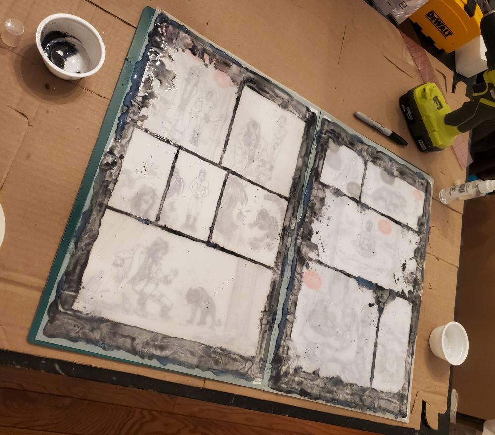 Process shot of making distressed panel gutters for comic page art.