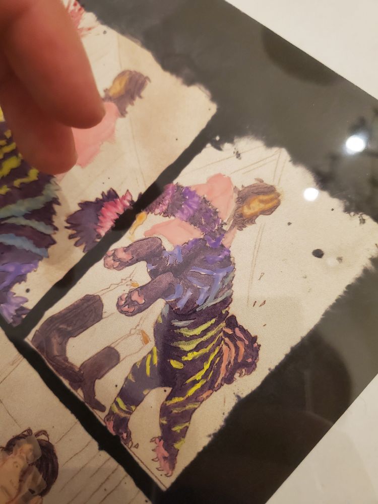 An image showing the colors for a comic panel painted loosely on transparent plastic film.