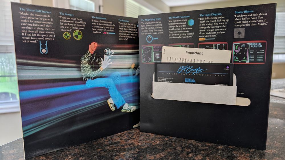 The interior of the album-style sleeve with 5.25" disk and warranty card visible.