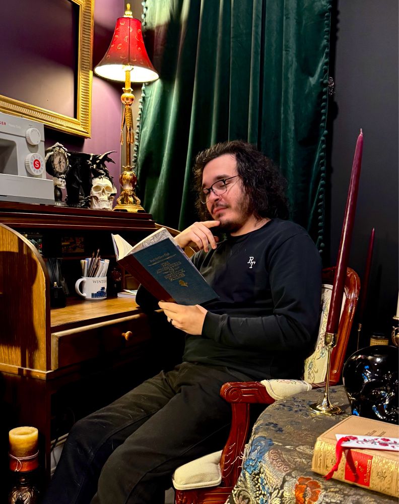 Me looking ponderous with a Sherlock Holmes book in a well decorated corner. I’m so handsome.