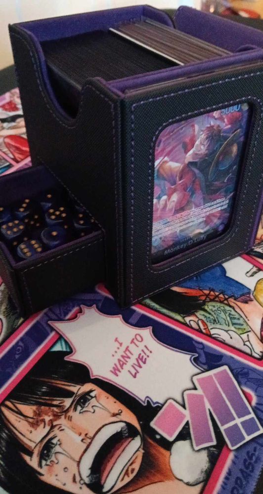 Deckbox from Magetech featuring Purple Luffy deck on a Nico Robin playmat.
