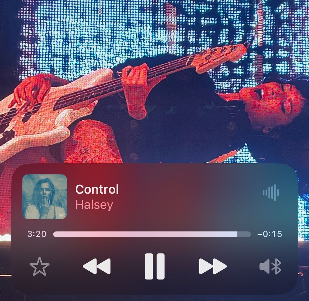 screenshot of grace’s lock screen and it’s a super hot picture of halsey playing bass and the song “control” by halsey is playing