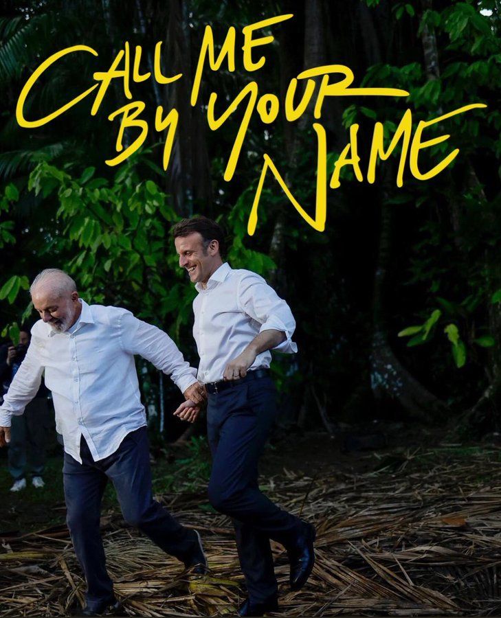 lula e macron de mãos dadas andando na mata - na imagem o título "call me by your name"