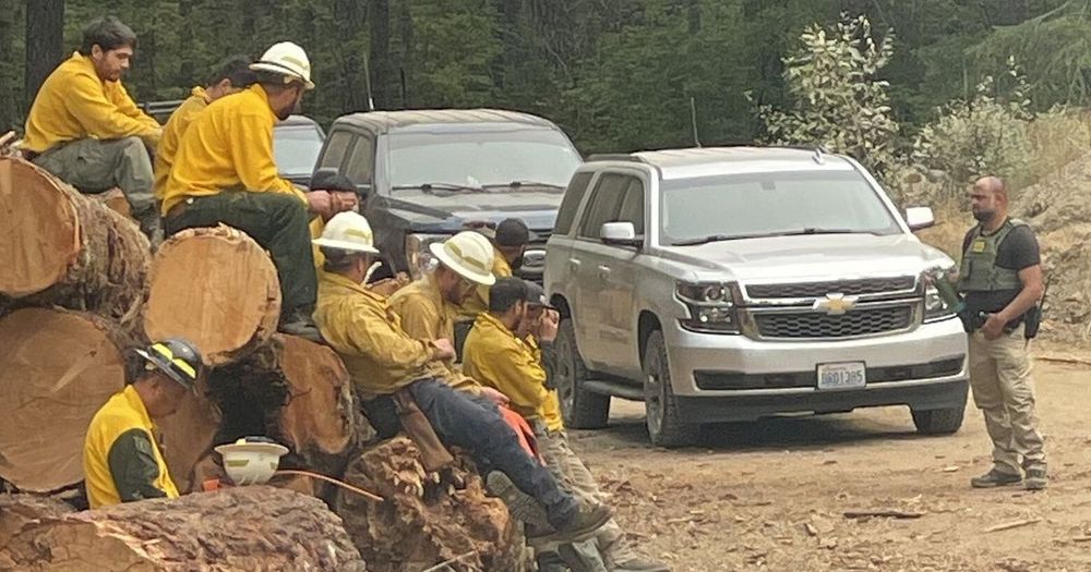 Federal agents showed up northeast of Lake Cushman to check identification of crew members fighting Washington's largest active wildfire.