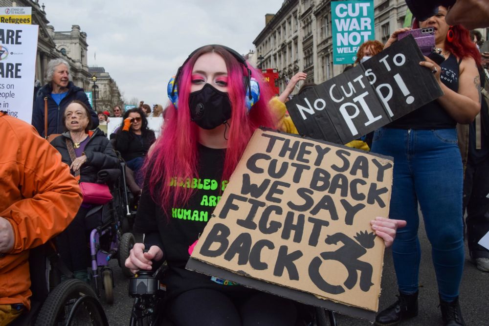 Disability rights activists march in London against social security cuts as the UK’s Chancellor Rachel Reeves presents her “Spring Statement” or mini-budget, March 26, 2025. © 2025 Vuk Valcic/ZUMA Press Wire/Shutterstock