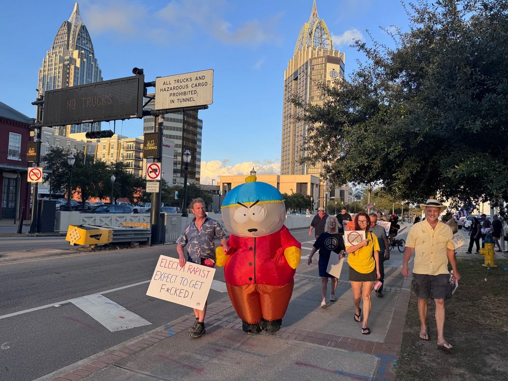Person dressed in inflatible Cartman costume at NoKings rally in Mobile, Alabama