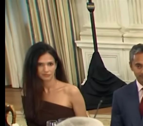 Picture of a woman seated at a formal dinner