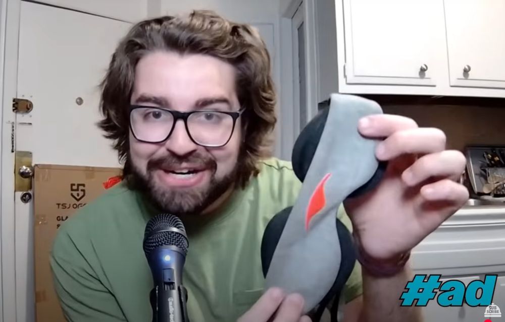 Brandon Donlon is holding a Manta Sleep Mask 