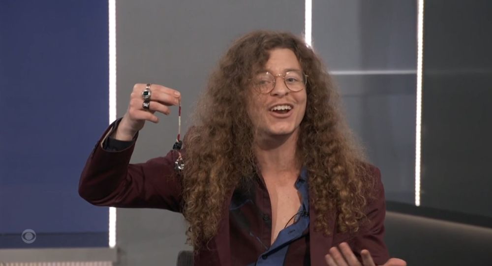 Quinn Martin is holding a bracelet pretending it's a hidden immunity idol