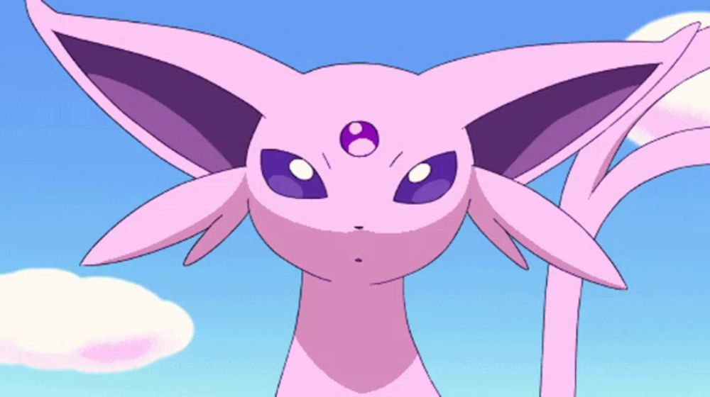 a close up of a pink cartoon character with a purple eye