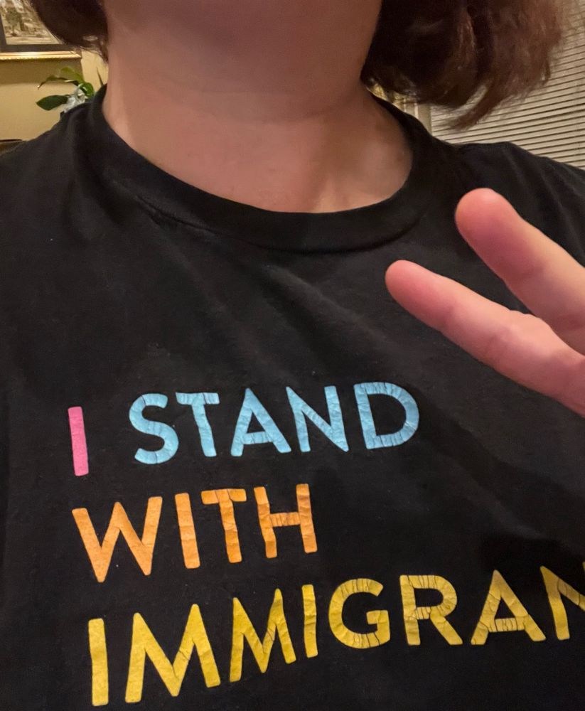 My t-shirt reads, “I stand with immigrants”.