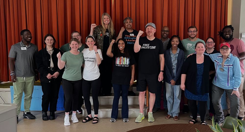 Multiracial group with fists up for solidarity 