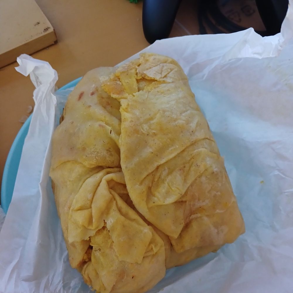 a wrapped roti or dhalpuri