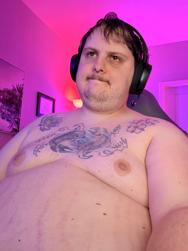 A fat white guy with his tiddies out