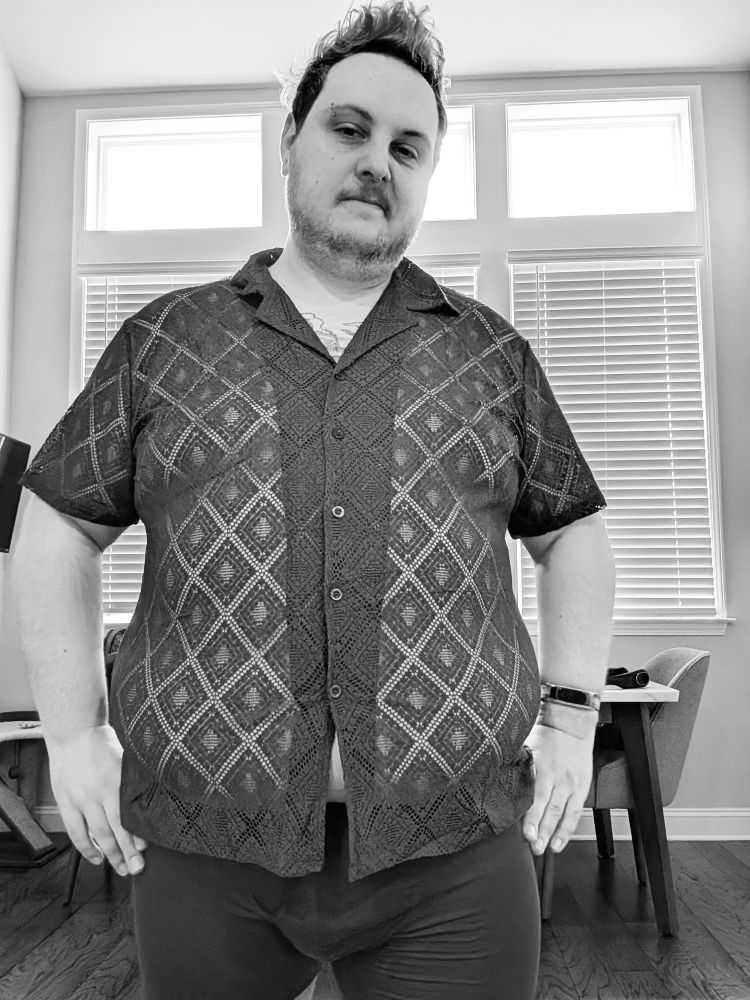 A black and white version of the buttoned up shirt photo. The colors are all shades of grey. 
