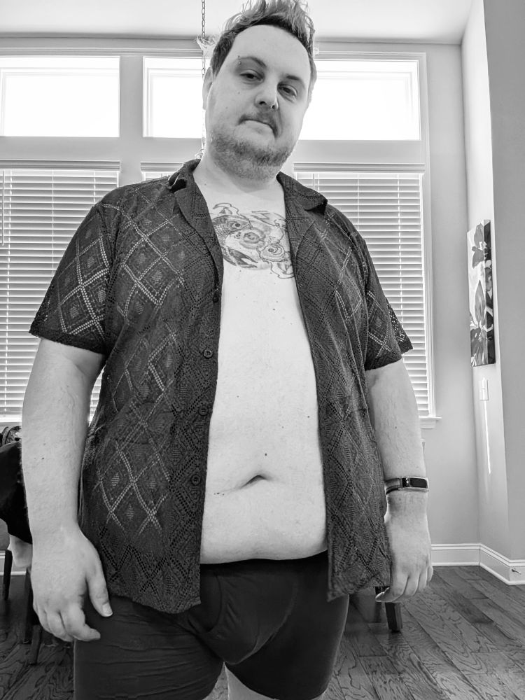 A black and white version of the unbuttoned shirt photo. The colors are all shades of grey. 