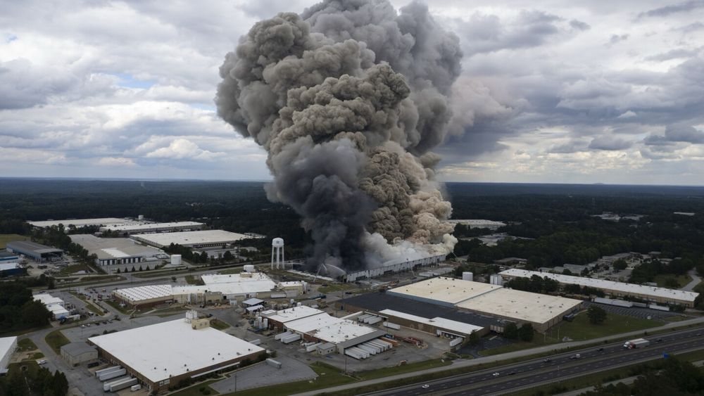 Authorities say heavy smoke is causing low visibility along Interstate 20 east of Atlanta from chemicals spewing from a beleaguered chlorine facility.