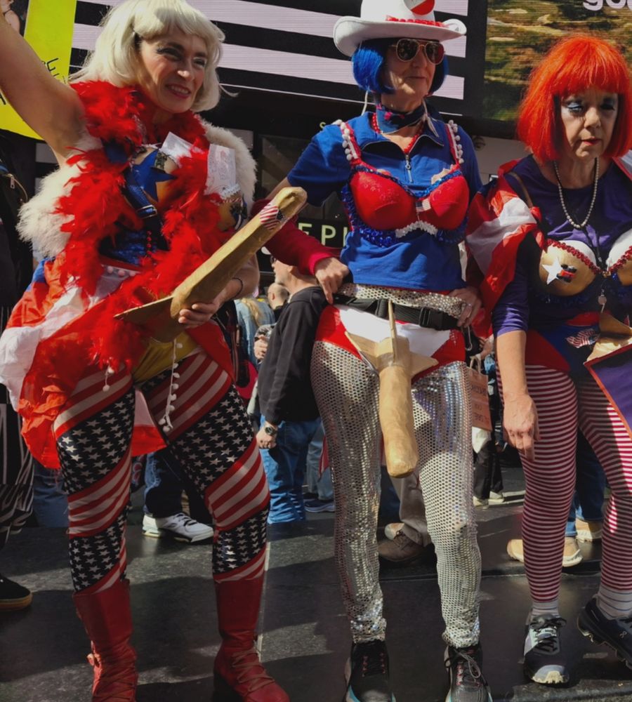 Colorful and somewhat obscene antiwar women in costume