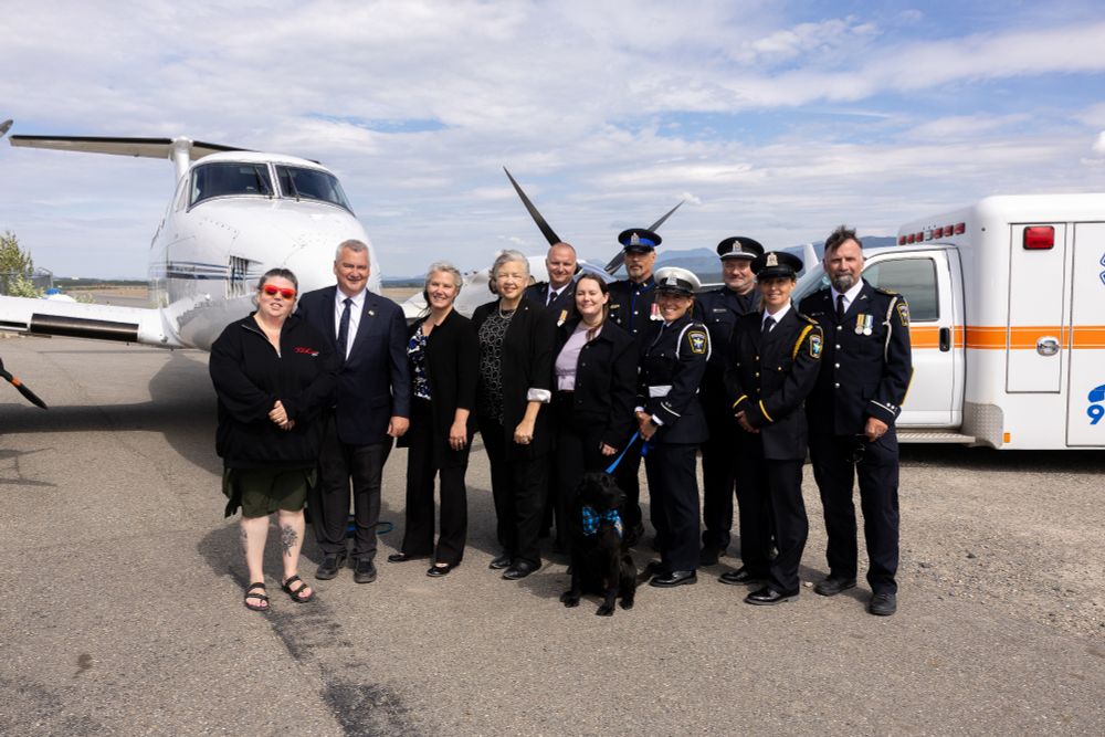 Tiffany Eckert-Maret of the Yukon First Nation Air Leasing Limited Partnership, Yukon Premier Mike Pemberton, Alkan Air CEO Lacia Kinnear, Minister of Health and Social Services Tracy-Anne McPhee and other partners and EMS staff pose for a photo following the announcement of the Government of Yukon’s awarding of a new 10-year contract to Alkan Air Limited to continue delivering reliable, high-quality fixed-wing air ambulance services across the territory on Tuesday July 29th at Alkan Air hanger at the Whitehorse Airport