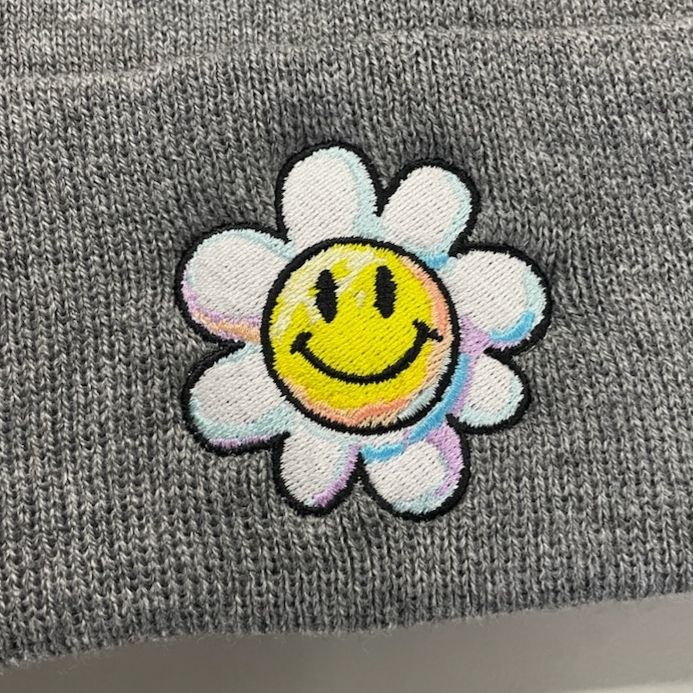 A machine embroidered smiling Daisy from Yoshis Island.