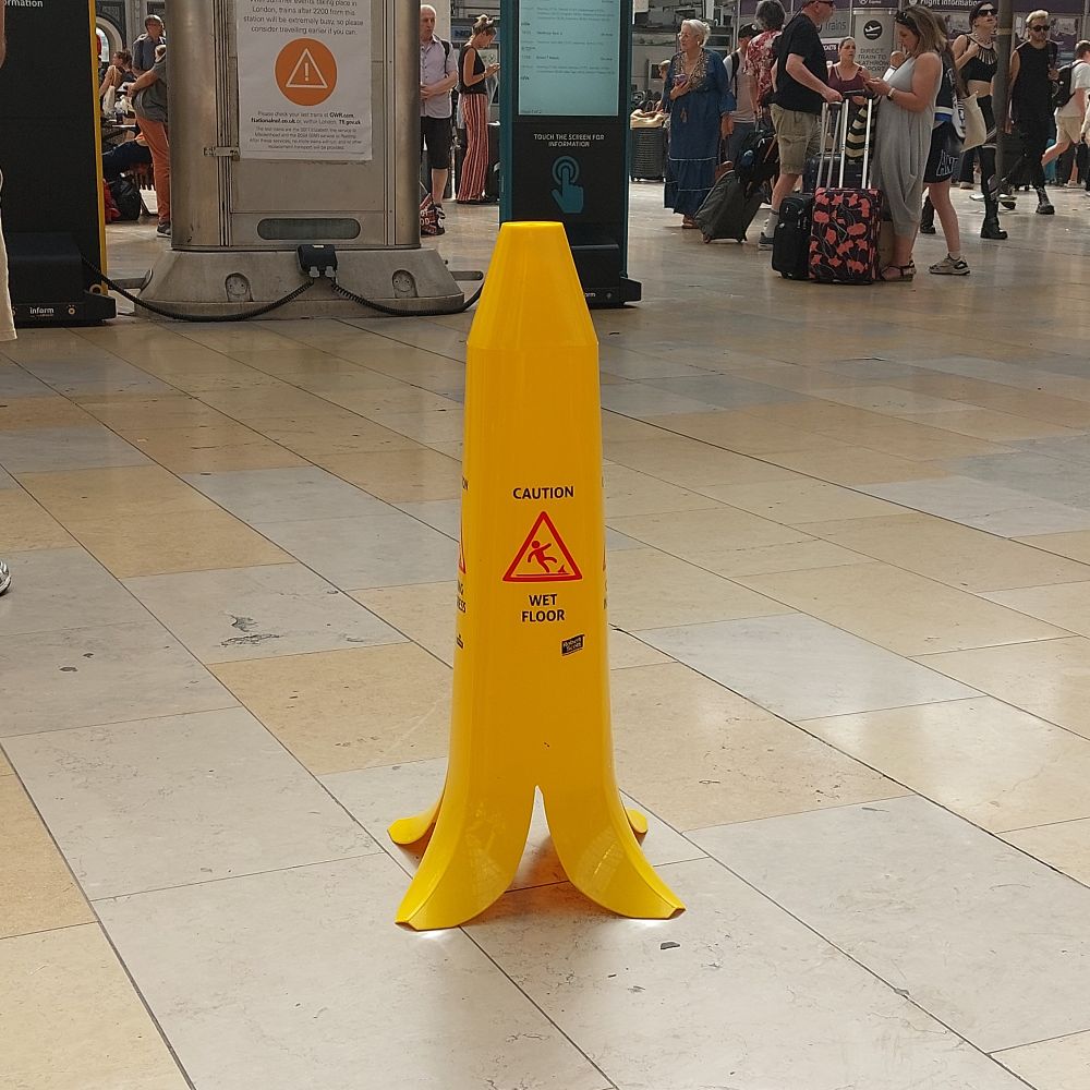 A moveable bollard to warn rapid walkers that the station floor is slippery, in the colour and shape of a (straight) banana.