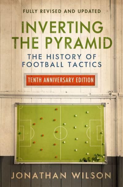 Front Cover of the 10th Anniversary edition of 'Inverting the Pyramid' by Jonathan Wilson. Old style dressing room wall of wooden planks with a modern tactics board including red and white round markers.