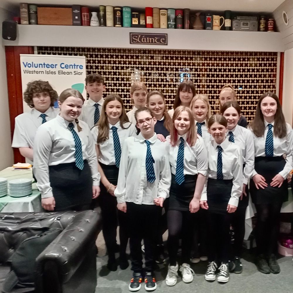 A group of students from Sir E Scott School who are involved in running a coffee morning.