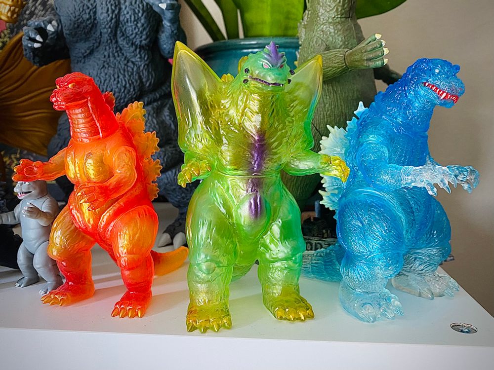 the translucent CCP Middle Size Godzilla figures again, but now I have one more. Left to right:
Orange + Red Heisei Godzilla 
Green + Purple SpadeGodzilla
Blue + Clear GMK Godzilla