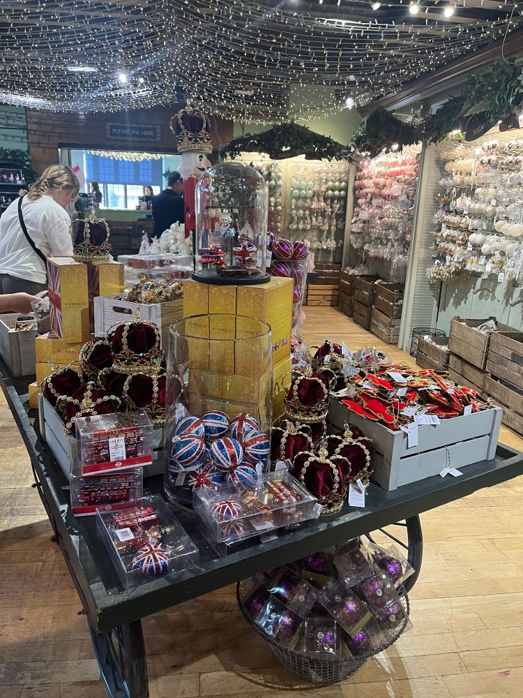 A table piled high with Christmas crowns, Union flags, queen heads and buses 