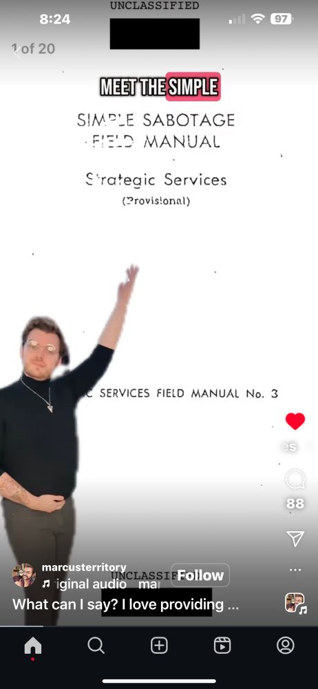 A man pointing to the name of a book