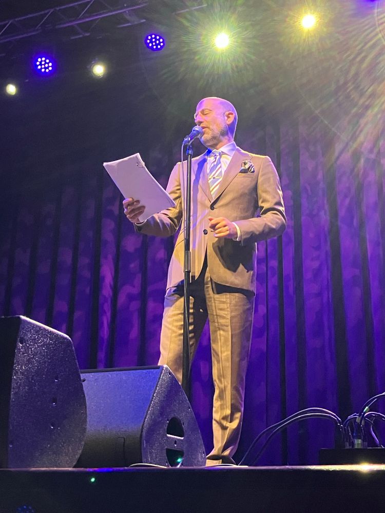 Cecil Baldwin performs on stage. 