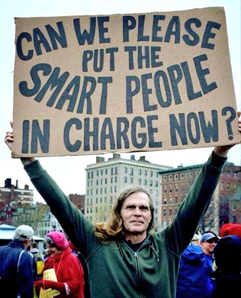 Sign: “can we put smart people in charge now please!”