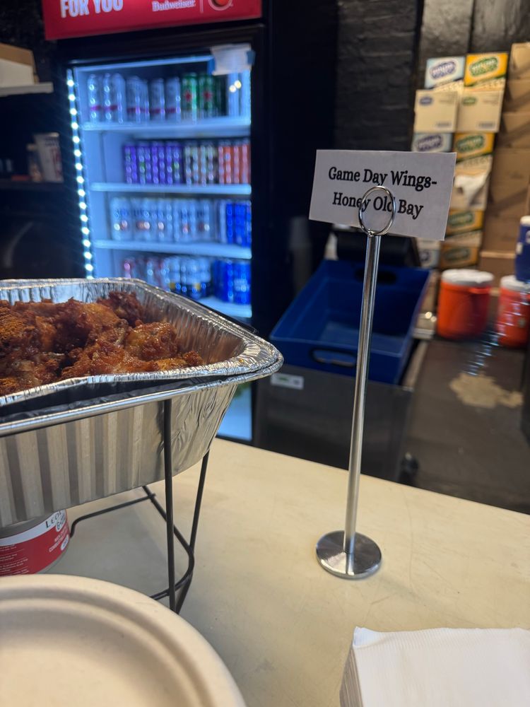 Sign reads game day wings — honey old bay