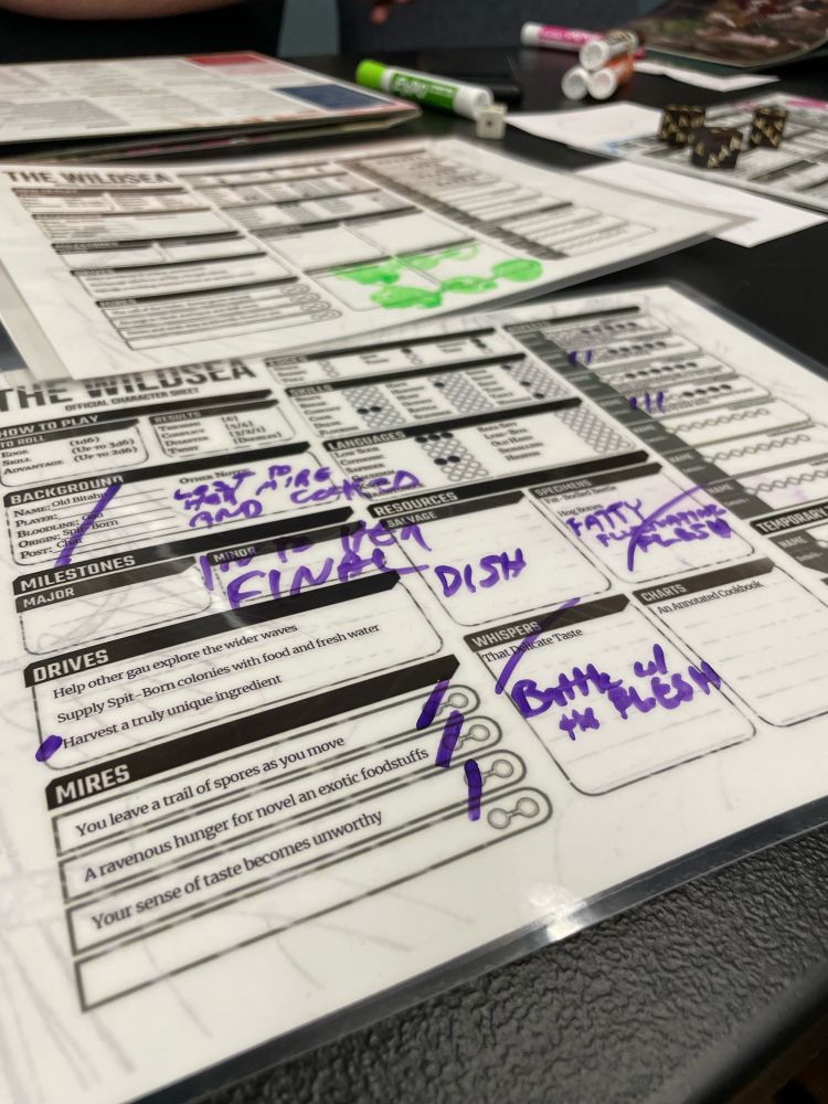 Laminated Wildsea Gau char character sheet with three marks mires
