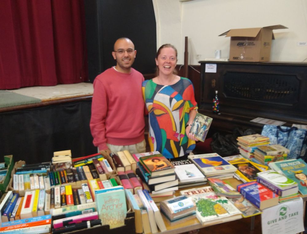 The bring-n-take stall, covered in books waiting for a new home.