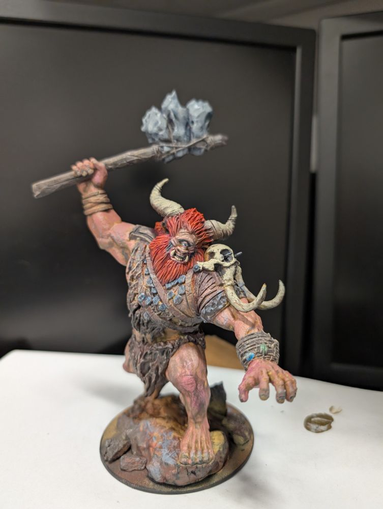 Shown is a hand-painted miniature of a Magic the Gathering character, a cyclops named Borborygmos, from a very slightly different angle