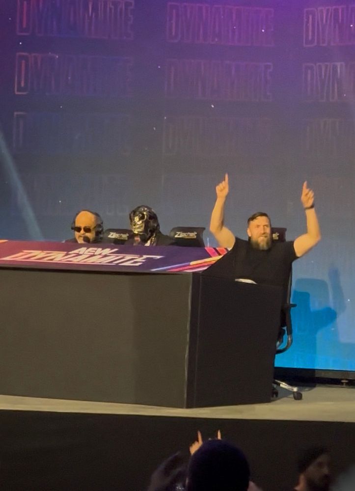 A photo of Bryan Danielson doing the yes chants next to Excalibur and Taz