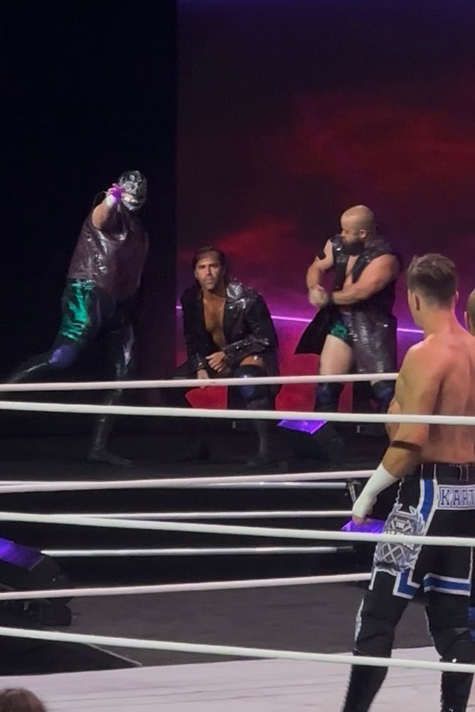 A picture of Dark Order walking to the ring 