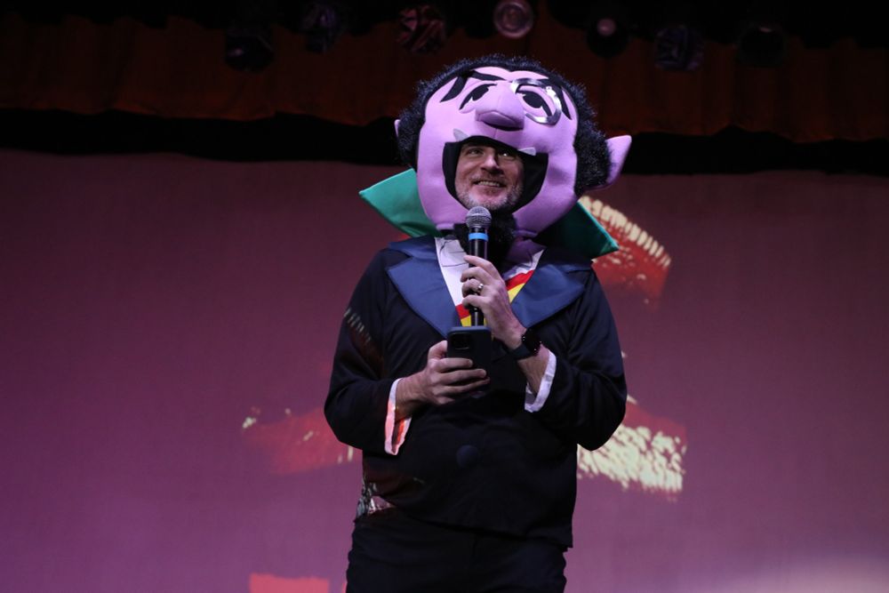 Me, smiling inside a costume of Count von Count the sesame street character