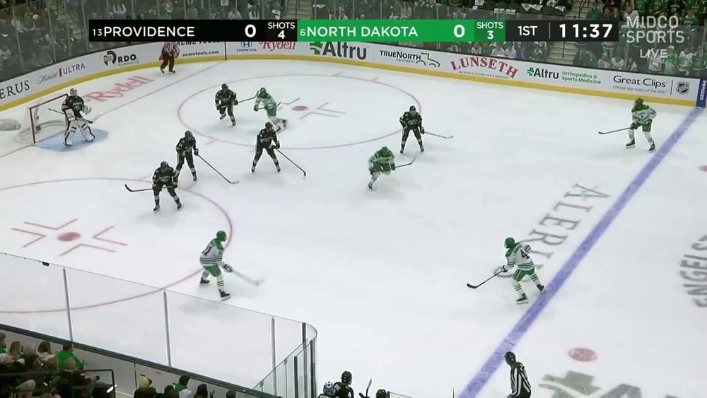 #NYR first-round pick EJ Emery registered a primary assist in his first NCAA game for North Dakota. He smoothly handles a really hard pass in his skates and then finds Cameron Berg backdoor for a tap-in.