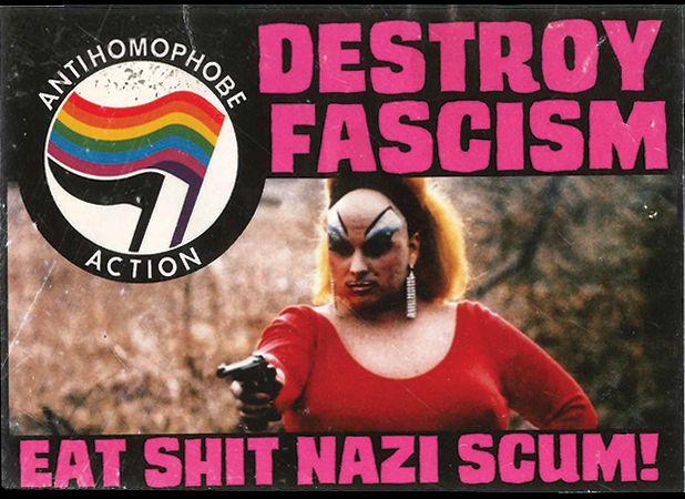 Sticker depicting actor Divine holding a pistol. Text reads "Destroy Fascism - Eat Shit Nazi Scum" and has a rainbow flag and a black flag in the upper left with the words "Antihomophobe Action"