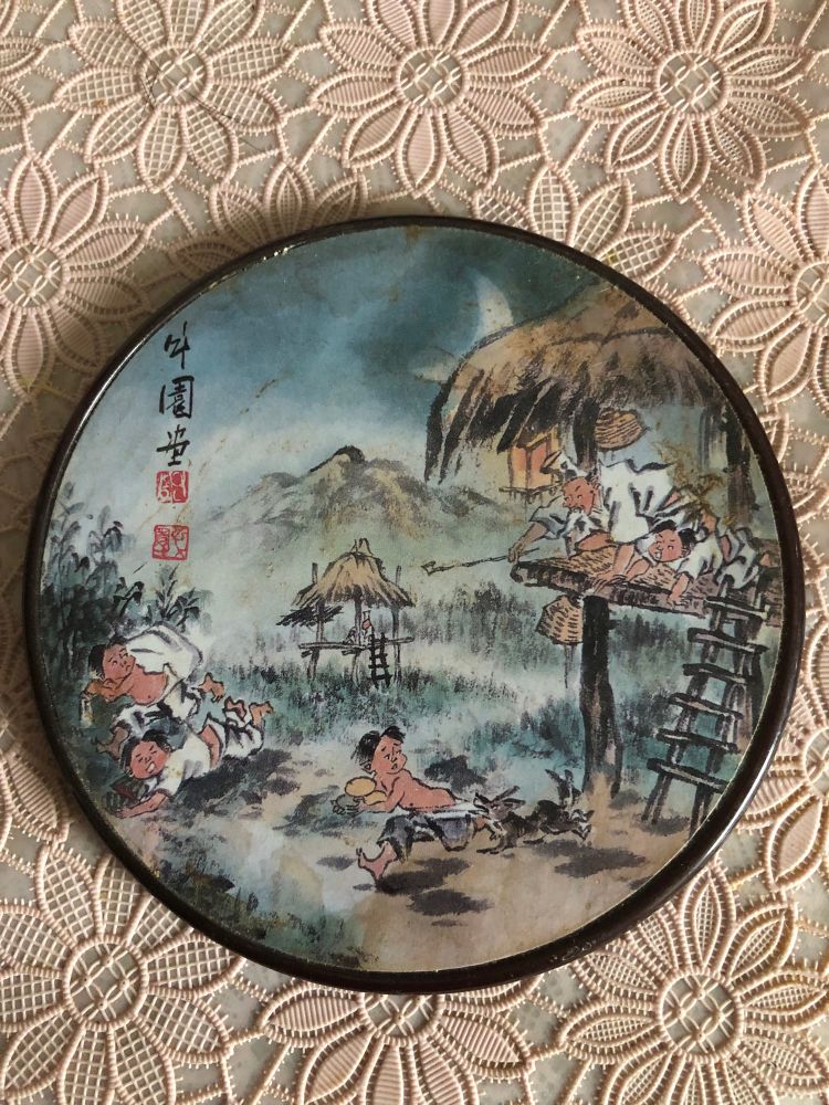 Three children running away from an angry man with stolen watermelons