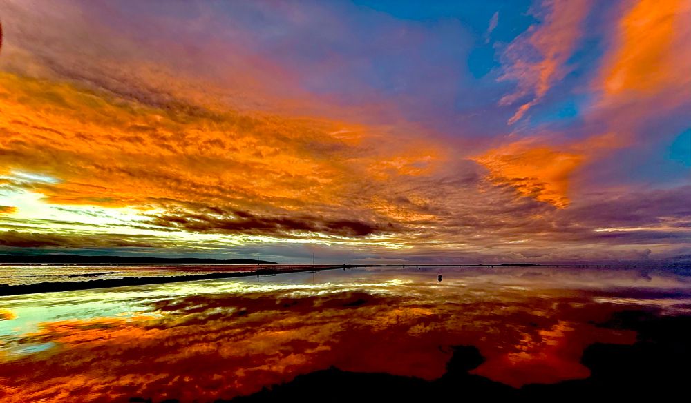 An incredible sunset reflected in a very still lake - a mirror lake
