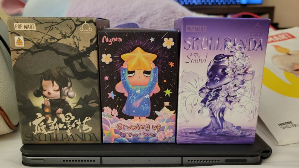 Skull panda The Sound Series and The Ink Plum Blossom Series figurine blind boxes and a Nyota Growing Up by Your Way figurine blind box.