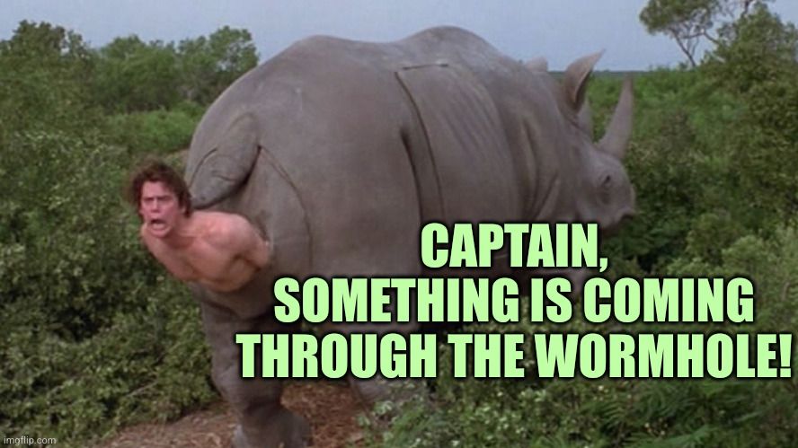 A grown naked white man being born from the back of a rhinocerous