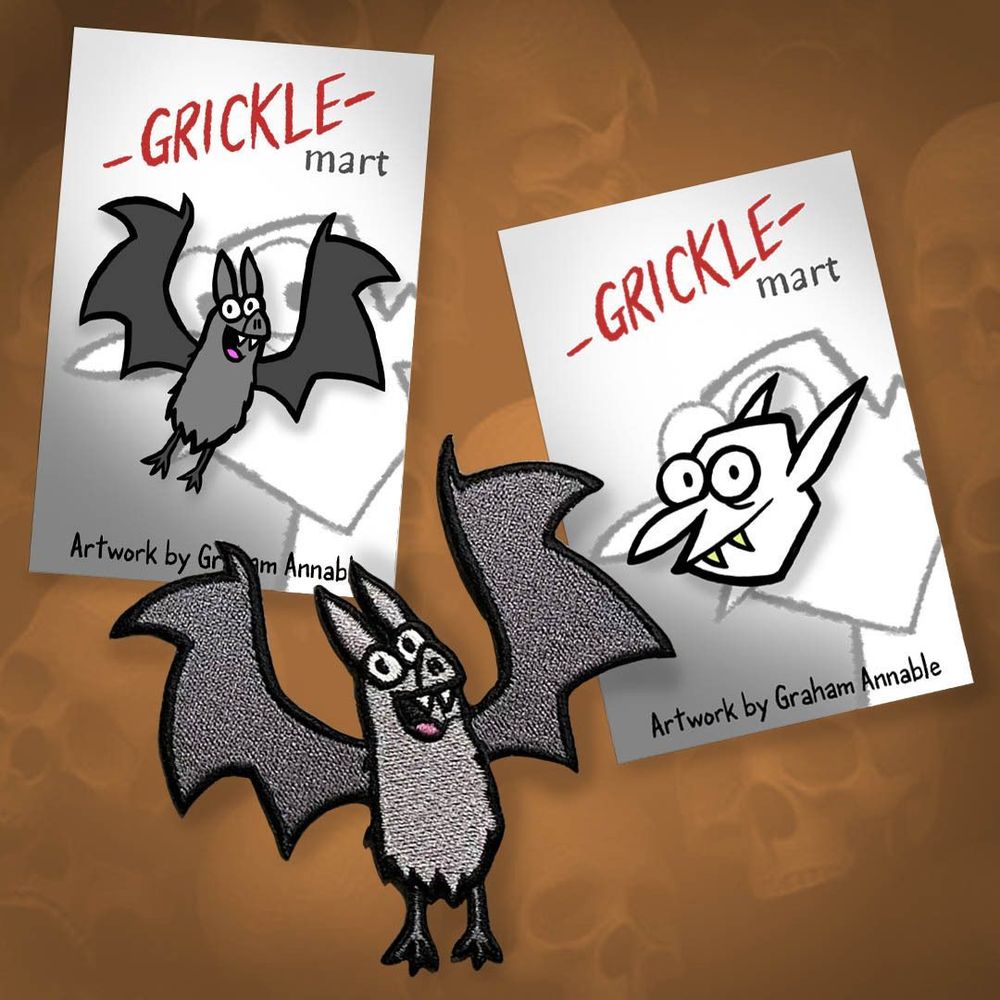 An image of a Grickle Bat pin, a Grickle Vampire pin and a Grickle Bat patch. Available at gricklemart.com