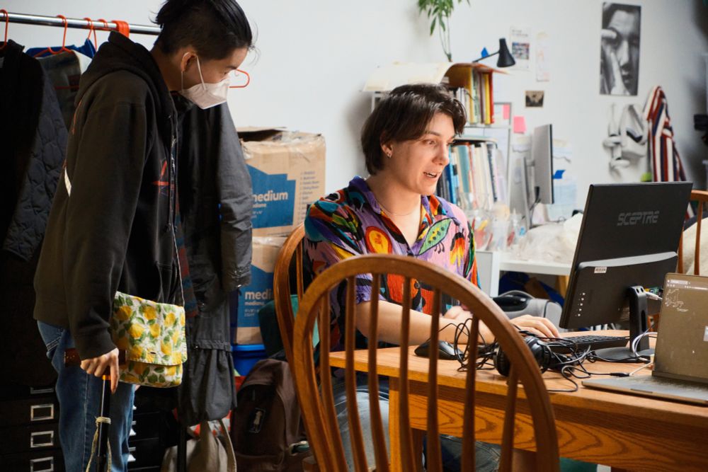 Photo of attendees playing a game in a computer screen