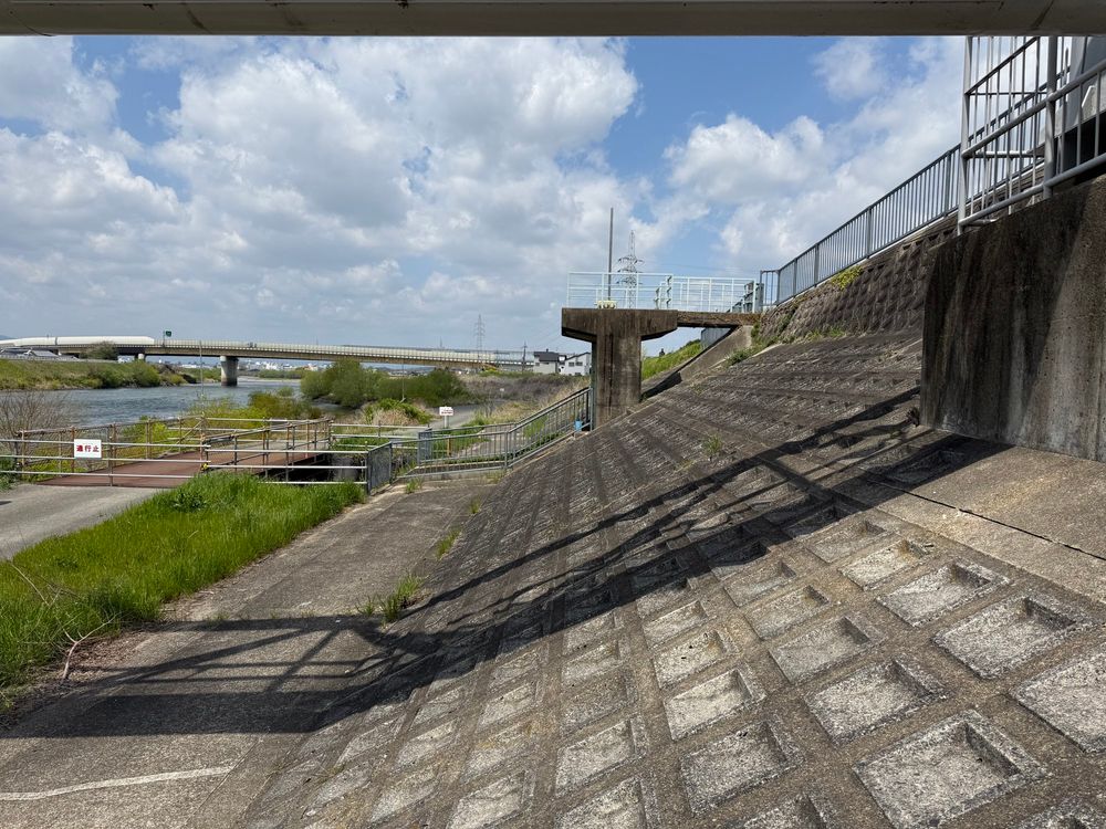 The slope of a river levee beneath a water pipe